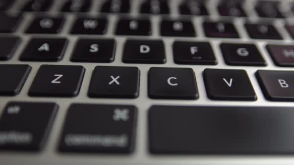 Close-up macro view of keyboard on the laptop computer. 4k footage of modern laptop keyboard alt