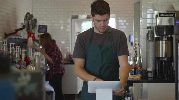 Man working at coffee shop