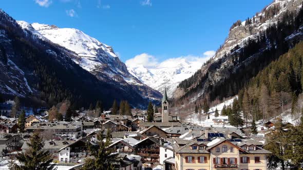 Aerial view of Alpine chapel in Gresonei Saint Jean Italy Aosta Valley. Winter season alt