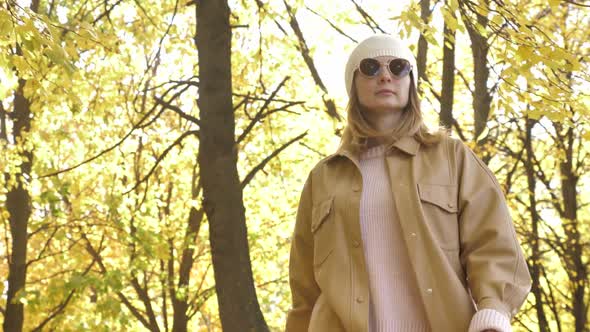 Outdoor Autumn Fashion of Young Lady in Knitted Sweater, Leather Jacket, Sunglasses alt