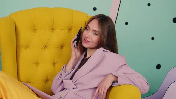 Stylish Woman Is Relaxing and Enjoying Phone Talk