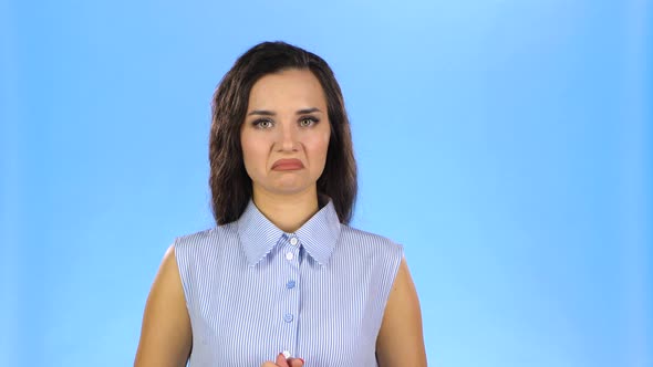 Pretty Young Woman Is Listening and Showing Thumbs Up alt