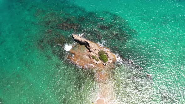 Aerial Top View Above Small Island At Yanui Beach alt