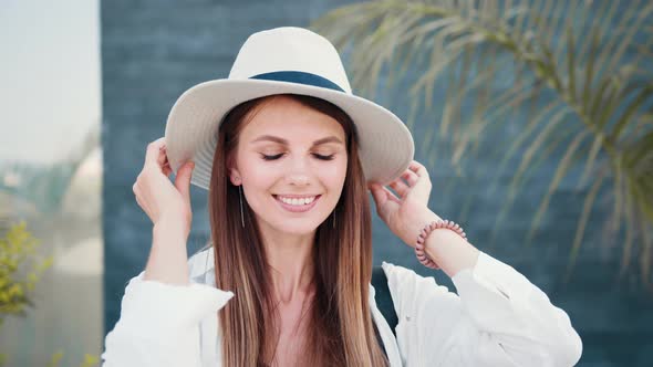 Beautiful Caucasian Woman in Sunglasses and Summer Clothes Standing on Street alt