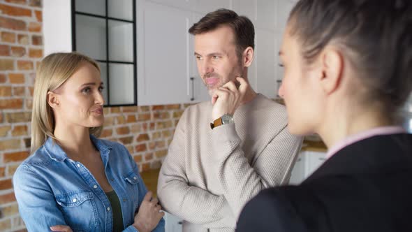 Video of couple during a meeting with estate agent. Shot with RED helium camera in 8K. alt
