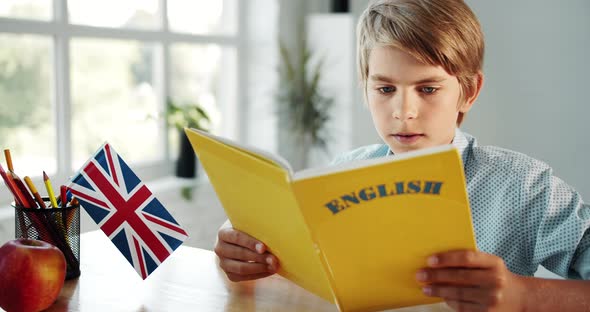 Boy Studying English in Classroom