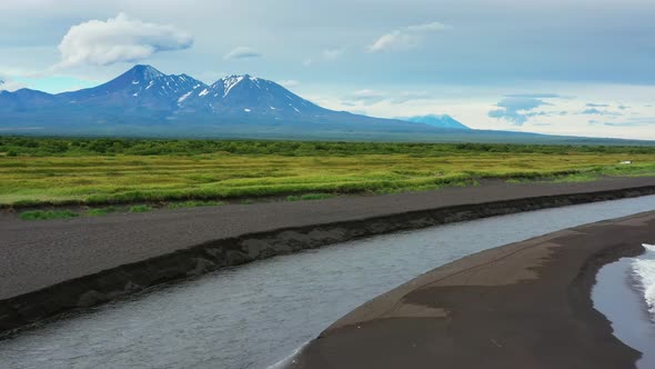 Beach with Black Sand and Volcano alt
