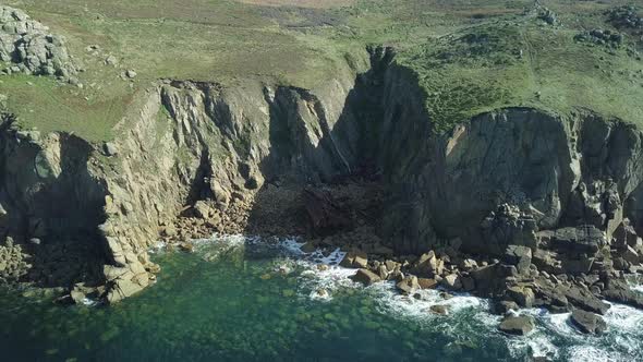 Half Of RMS Mulheim Shipwreck In An Island Inlet At Land's End Cornwall England - aerial shot alt