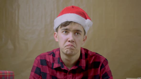 Lonely Melancholy Man in Plaid Shirt at Christmas