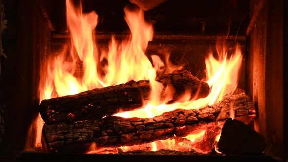 Warm Cozy Burning Fire in a Brick Fireplace Closeup Shot