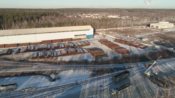 Round metal pipes in Metal warehouse. The locomotive rides on the railroad 03 alt