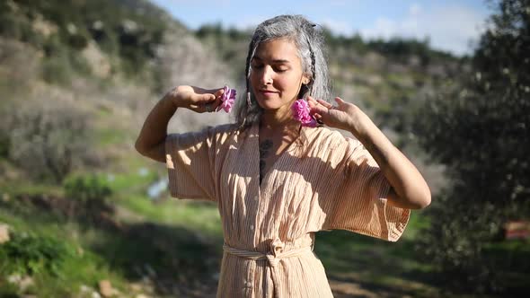 Beautiful women is dancing in the nature. alt