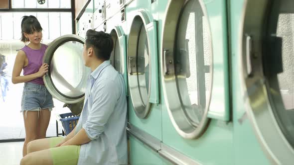 A Young Man and a Young Woman meet in a Launderette whilst doing their laundry