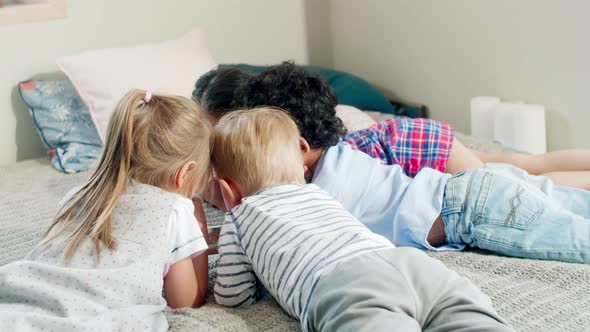 Little Friends Watching Cartoon on Tablet