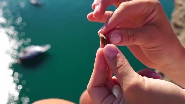 Woman Eating Milky Almond Nuts alt