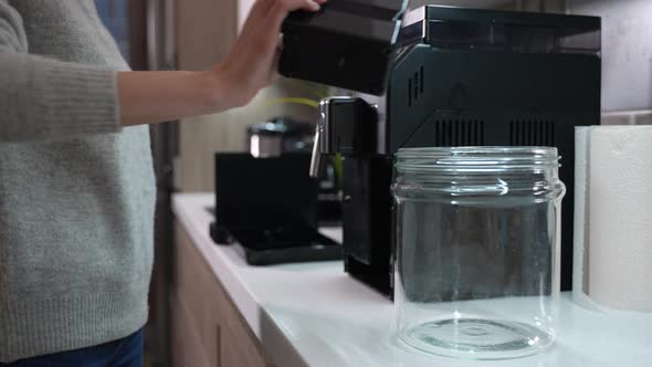 Girl Collects Coffee Grounds for Recycling alt