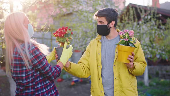 Young Man with a Protective Mask and His Lady with alt