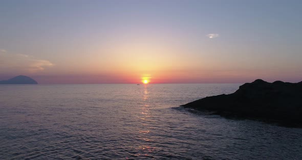 Aerial View of a Colorful Sunset Above the Sea Aeolian Islands alt