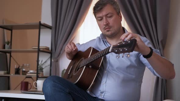 Instrumental Tuning Male Player Adjusting Sound alt