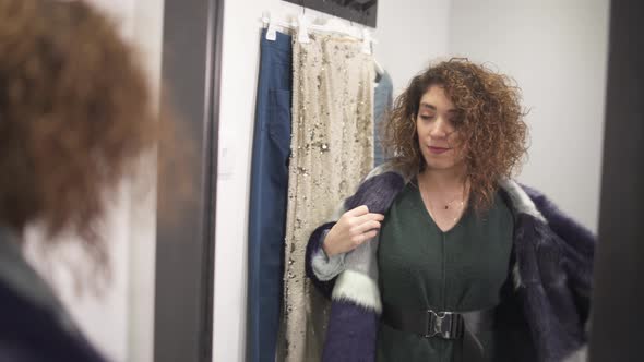 Happy Customer Trying on Clothes in Fashion Store Changing Room
