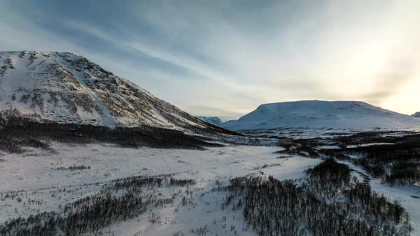 Hyperlapse drone aerial over Oldervikdalen valley in Norway. Winter. alt