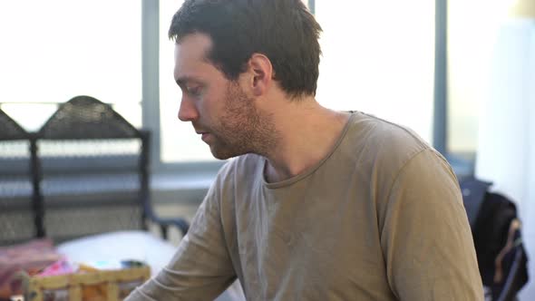 Man painting in studio