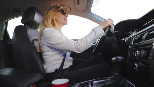 Woman Listening Music While Driving