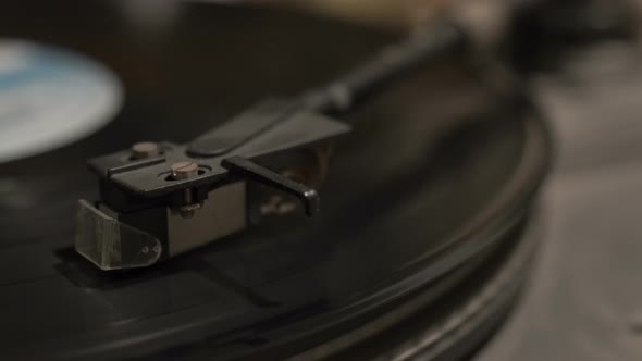 Turntable player, dropping stylus needle on vinyl record playing