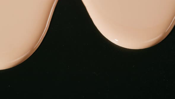 Flowing Foundation Tone on Black Background alt