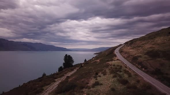 Scenic road by lake in New Zealand