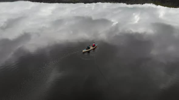 Tranquil Canoe Adventure On Lake with Reflection on Water Leisure Aerial alt