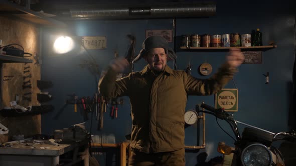 The Russian Peasant Is Dancing in a Padded Jacket, a Hat with Earflaps and Felt Boots alt