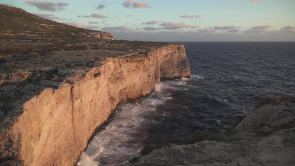 Uneasy Mediterranean Sea Crashes Waves on Coastline Shore in Malta Island During Winter
