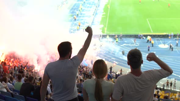 Friends Cheering for Winning Goal, General Excitement During Football Match alt
