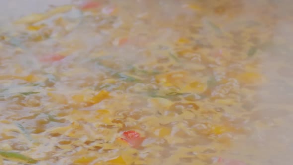 Slow Motion: Process of Cooking Healthy Yellow Soup Vegetables - Close Up