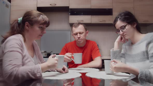 Family Drink Tea in the Evening at the Same Time Simultaneously Bring Glasses To the Face