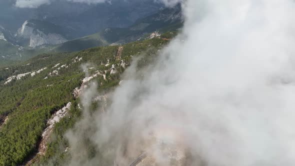 Cloudy landscape high in the mountains aerial view 4 K alt