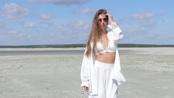 Beautiful Woman Walking on Shore