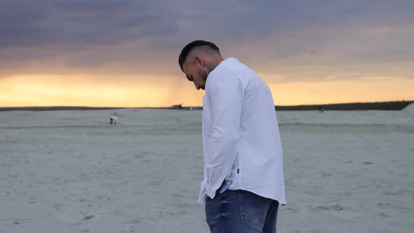 Brutal Man Walking on Beach