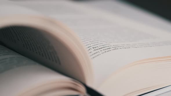 Turning Pages of a Book CloseUp Slow Motion alt