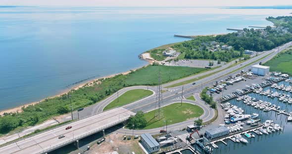 Aerial view naval maritime sailing port small with motor boats lined up along the pier ocean alt