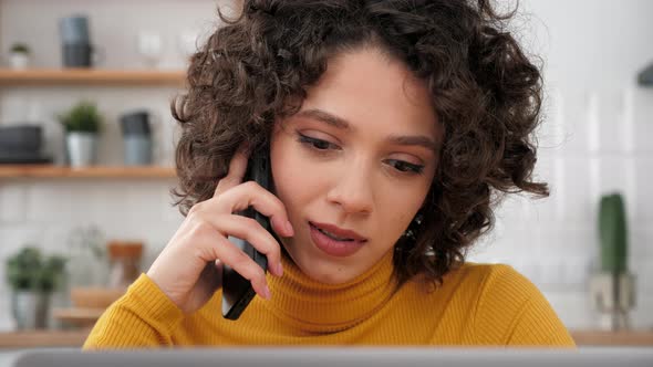 Close Up Hispanic Curly Woman Student Talking on Mobile Phone Using Laptop alt