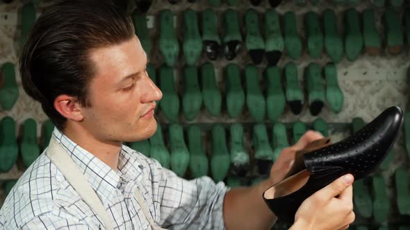 Shoes Repairman Polishing Leather Shoe Smiling Joyfully To the Camera 1080p alt