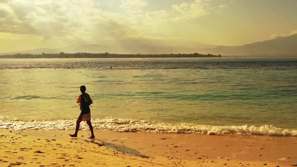 Guy angling on relaxing sea view beach journey by blue ocean with clean sand background of Gili Traw alt