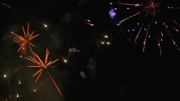 Fireworks Flashing in the Night Sky. Slow Motion. Real Fireworks with Smoke alt