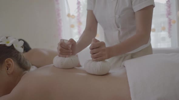 Beautiful Young Woman Massage Multiethnic women relaxing at spa center with a therapy. alt