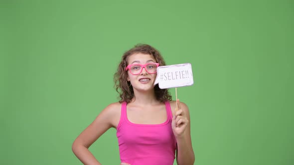 Young Happy Beautiful Nerd Woman with Selfie Paper Sign alt