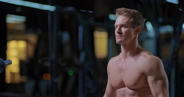 Portrait of a Young Athlete Tired at the End of Training, Breathing Deeply, Professional Sportsman alt