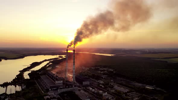 Aerial View on a Huge Industrial Factory Among Nature alt