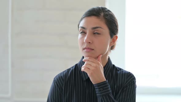 Young Indian Woman Thinking and Getting Idea alt